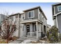 Attractive two-story house with a cozy front porch and a combination of siding and stone at 9667 Walden St, Commerce City, CO 80022