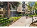 Building exterior with a sidewalk, manicured lawn, and building number above the front entrance at 3082 S Wheeling Way # 202, Aurora, CO 80014