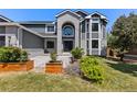 Up-close view of a charming home with manicured landscaping and a modern design at 9382 Lark Sparrow Dr, Highlands Ranch, CO 80126