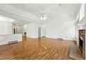 Bright living room with hardwood floors, vaulted ceilings, and a cozy fireplace at 517 Rider Ridge Dr, Longmont, CO 80504