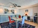 Modern dining room with glass table and colorful chairs at 1777 Larimer St # 1908, Denver, CO 80202