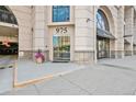 Building entrance at 975 with modern glass doors and a salon located on the main level at 975 N Lincoln St # 3E, Denver, CO 80203