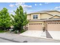 Charming home with three car garage, beautiful stone accents, and well-maintained landscaping at 22391 E Plymouth Cir, Aurora, CO 80016