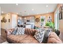 Comfortable living space showcasing an open layout and seamless flow into the adjacent kitchen at 8552 W San Juan Ave, Littleton, CO 80128