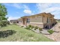 Beautiful home with manicured lawn and landscape, showcasing the exterior's appealing curb appeal at 12258 Hazel Spruce Ct, Parker, CO 80134