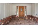 Welcoming front porch featuring a wood door with glass sidelights, brick accents, and a 'welcome' mat at 4862 Silver Sage Ct, Boulder, CO 80301