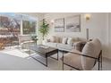 Sun-filled living room with comfortable seating, natural light, and modern décor at 1747 N Washington St # C306, Denver, CO 80203
