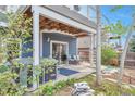 Back patio boasts comfortable outdoor seating, a hot tub, and lush landscaping at 9371 Desert Willow Trl, Highlands Ranch, CO 80129