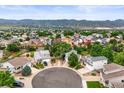 Aerial view of a quiet cul-de-sac community with mountain views at 9620 Mallard Pond Way, Littleton, CO 80125
