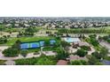 Aerial community view showcasing a neighborhood pool, tennis courts, and residential homes at 5723 S Kittredge St, Centennial, CO 80015