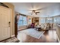 Bright and open living room with hardwood floors and large windows at 8345 Moore St, Arvada, CO 80005