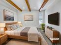Relaxing main bedroom boasting exposed wood beam ceiling and neutral decor at 4365 S Alton Way, Greenwood Village, CO 80111