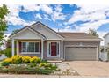 Charming single-Gathering home featuring a well-manicured lawn and two-car garage at 5403 Odessa St, Denver, CO 80249