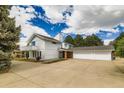 Expansive two-story home with a three-car garage and concrete driveway at 6668 Walker Ct, Niwot, CO 80503