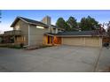 Charming exterior view of a home boasting a spacious driveway and a three-car garage at 6668 Walker Ct, Niwot, CO 80503