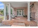 Inviting front porch with rocking chairs, offering a comfortable outdoor space to enjoy the view at 13955 Craig Way, Broomfield, CO 80020