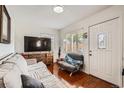 Inviting living room featuring hardwood floors, modern furniture, and natural light at 6736 Grove St, Denver, CO 80221