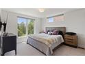 Light-filled bedroom with a large window and plush bedding at 2851 W 23Rd Ave # 1, Denver, CO 80211