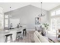 Open concept dining area with modern lighting, stylish decor, and seamless flow to living spaces at 3328 S Danube St, Aurora, CO 80013