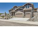 Charming two-story house boasting a two-car garage and attractive stone detailing at 4748 Weitbrec Ln, Castle Rock, CO 80104