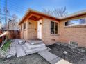 Charming brick home with a well-maintained front yard and inviting entrance at 732 Poplar St, Denver, CO 80220