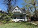 Charming two-story home with small front porch and quaint landscaping in established neighborhood at 3950 Lowell Blvd, Denver, CO 80211