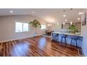Spacious kitchen with hardwood floors, stainless appliances, and bright lighting at 5389 W Roxbury Pl, Littleton, CO 80128