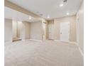 Spacious carpeted basement featuring neutral paint, recessed lighting, and access to other rooms at 39751 Congress Ln, Elizabeth, CO 80107