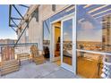 Open-air balcony showcases cityscape views and outdoor seating adjacent to the condo at 2020 Arapahoe St # 1250, Denver, CO 80205