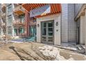 Attractive entryway showcasing the building name, a seating area, and the address of the building at 3100 Huron St # 3E, Denver, CO 80202
