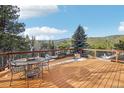 Spacious deck with outdoor seating, perfect for enjoying mountain views at 29477 Blue Moon Dr, Evergreen, CO 80439