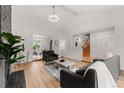 Bright living room with vaulted ceilings, hardwood floors, and an open layout at 12671 E Bates Cir, Aurora, CO 80014