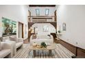 Bright living room with vaulted ceilings, wood accents, and stylish modern furniture at 5735 Big Canon Dr, Greenwood Village, CO 80111
