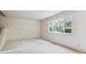 Spacious living room offers ample natural light and a staircase at 372 Vance St, Lakewood, CO 80226