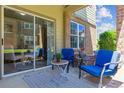 Cozy covered patio featuring comfortable seating and a sliding glass door entry at 12914 Ironstone Way # 102, Parker, CO 80134