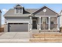 Charming single-Gathering home with a two-car garage and landscaped front yard at 9099 Pitkin St, Commerce City, CO 80022