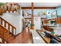 Bright living room with high ceilings, hardwood floors, and a unique staircase at 7300 W Stetson Pl # 46, Littleton, CO 80123