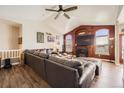 Spacious living room with a fireplace, large windows, and comfortable seating at 16650 Shadow Wood Ct, Hudson, CO 80642