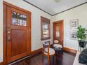 Entryway with hardwood floors and vintage wooden doors at 3412 Zuni St, Denver, CO 80211