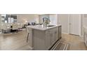 Modern kitchen island featuring stainless steel appliances and an open concept floor plan at 6150 Sugarloaf St, Brighton, CO 80601