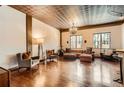 Spacious living area featuring hardwood floors, a decorative ceiling, and ample seating with natural light at 1735 19Th St # 5B, Denver, CO 80202