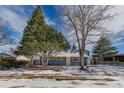 Attractive two-story home, showcasing a blue exterior, natural light and landscaped front yard at 1120 Hartford Dr, Boulder, CO 80305