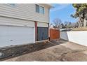 Spacious driveway and garage of a two-story home with a large, fenced yard, offering ample parking and storage at 9886 Appletree Pl, Thornton, CO 80260