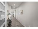Inviting entryway featuring wood floors, neutral paint, and elegant decor at 3429 Goodyear St, Castle Rock, CO 80109