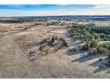 Aerial view showcasing a home situated on large tract of land with mature trees, offering privacy at 754 Highway 86 Hwy, Elizabeth, CO 80107