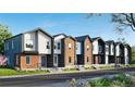 Contemporary townhome complex with brick and modern siding, showcasing a well-maintained landscape at 9061 E 14Th St, Aurora, CO 80010