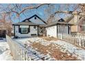 House exterior showcasing snowy front yard and white picket fence at 4723 S Pagosa Way, Aurora, CO 80015