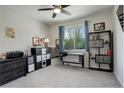 Comfortable bedroom with carpet, a window for natural light, and ample storage space at 6630 S Coolidge Ct, Aurora, CO 80016