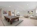 Finished basement with a pool table, foosball, and comfortable seating at 20816 E Shefield Pl, Parker, CO 80138
