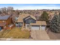 Aerial view of a well maintained home with multiple car garage and mature trees at 1769 W 113Th Ave, Denver, CO 80234